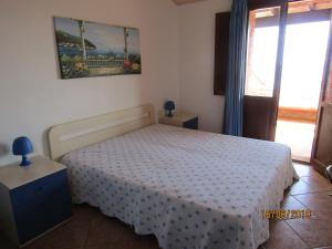 Gulta vai gultas numurā naktsmītnē Villetta Sole e Mare di Sardegna a Porto Corallo