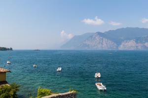 a number of boats in the water at Hotel Vega in Malcesine