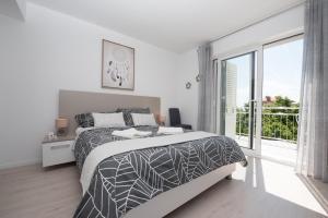 Ένα ή περισσότερα κρεβάτια σε δωμάτιο στο Villa Lorenzo