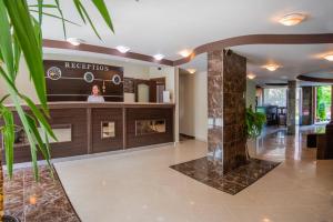a lobby of a hotel with a reception desk at South Beach Hotel - New Management and Free Beach Access in Tsarevo
