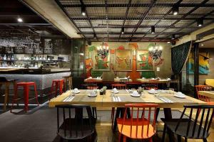 a dining room with a table and chairs in it at Hotel The Public - Special Category in Istanbul