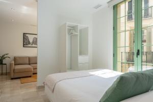 Posteľ alebo postele v izbe v ubytovaní Apartamentos Miraflores