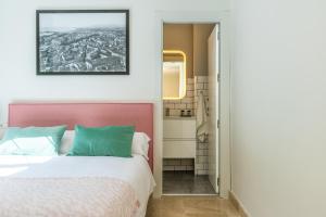 Posteľ alebo postele v izbe v ubytovaní Apartamentos Miraflores