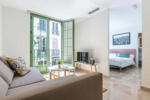 Posteľ alebo postele v izbe v ubytovaní Apartamentos Miraflores