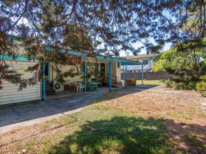 a house with a yard in front of it at 11 Peel Street in Tuncurry