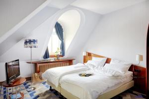 Postel nebo postele na pokoji v ubytování Seaside Park Hotel Leipzig