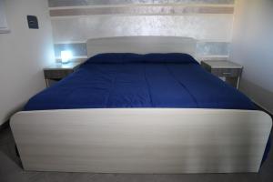 Łóżko lub łóżka w pokoju w obiekcie Villa Letizia