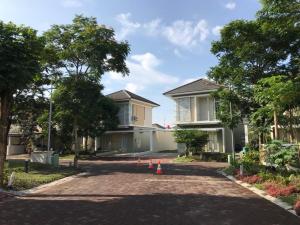 a driveway with orange cones in front of a house at Dipan Guest House Yogyakarta in Yogyakarta