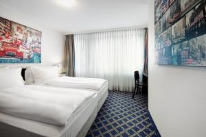 Postel nebo postele na pokoji v ubytování Hotel Stella Maris + 37 fotografií