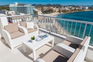 a balcony with chairs and a table and the ocean at Luisamar Sea View in Manacor