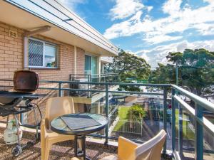 a balcony with a table and chairs on it at Albert Court 8 in Forster