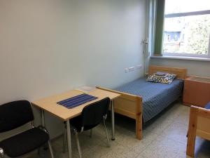 Voodi või voodid majutusasutuse Guesthouse Rehab toas +1 foto