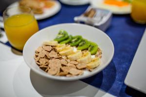 a white bowl of food on a table at IG Nachosol Atlantic & Yaizasol by Servatur - Adults Only in Puerto Rico de Gran Canaria