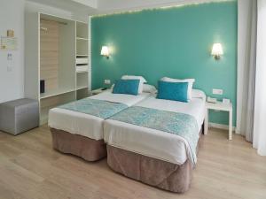Postel nebo postele na pokoji v ubytování BQ Apolo Hotel