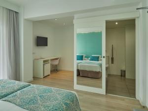 Postel nebo postele na pokoji v ubytování BQ Apolo Hotel