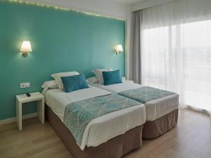 Postel nebo postele na pokoji v ubytování BQ Apolo Hotel