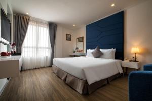 En eller flere senge i et værelse på Hanoi Backpackers Hostel & Rooftop bar