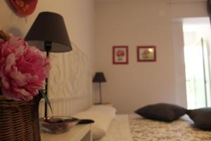 A bed or beds in a room at Villa Lucia B&B