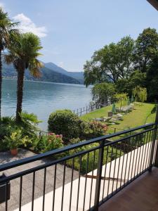 a balcony with a view of a lake at Albergo Del Lago in Cannobio