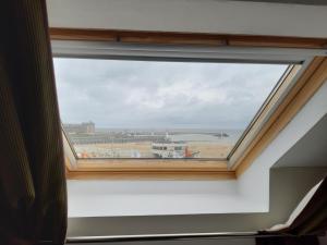 a window in a room with a view at Les Embruns in Trouville-sur-Mer