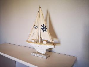 a toy boat sitting on a table at Apartmani Labud in Sukošan