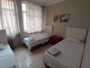 Postel nebo postele na pokoji v ubytování Hotel Yonca + 37 fotografií