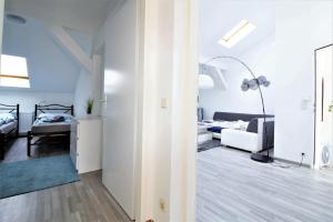 Postel nebo postele na pokoji v ubytování GOLD: Penthouse apartment Volkertmarkt