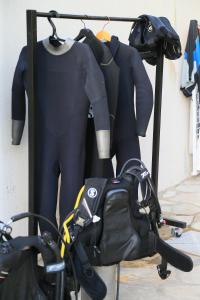 a couple of mannequins and a bag on a rack at Cimer SafraMarine Beach Resort in Safra