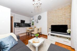 TV a/nebo společenská místnost v ubytování Apartment Kristina