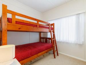 a bedroom with two bunk beds and a window at Wyvern in Forster