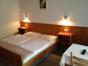 Postel nebo postele na pokoji v ubytování Pension & Appartement Fortin + 37 fotografií