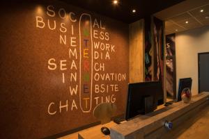 a wall with writing on it in a room at ibis Alger Aéroport in Alger