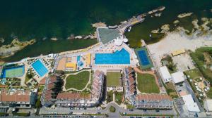 an aerial view of a building next to the ocean at Cimer SafraMarine Beach Resort in Safra