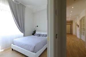 Postel nebo postele na pokoji v ubytování B&B Dimora del Duomo