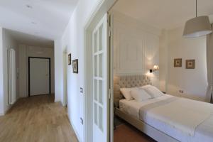 Postel nebo postele na pokoji v ubytování B&B Dimora del Duomo