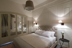 Postel nebo postele na pokoji v ubytování B&B Dimora del Duomo