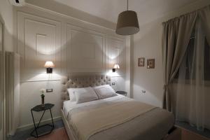 Postel nebo postele na pokoji v ubytování B&B Dimora del Duomo