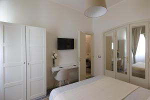 Postel nebo postele na pokoji v ubytování B&B Dimora del Duomo