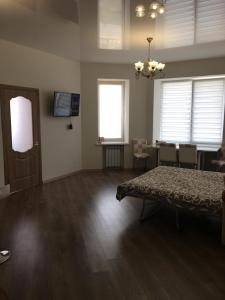 a living room with a table and a dining room at Квартира с видом на море in Chornomorsk