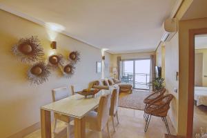 a living room with a table and a dining room at La Sal in Tazacorte