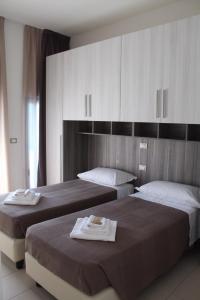 Posteľ alebo postele v izbe v ubytovaní Time Out ApartHotel