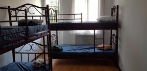 Postel nebo postele na pokoji v ubytování Enjoy The Hostel
