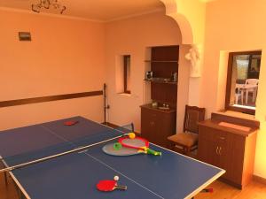 a ping pong table in a room with a ping pong table at Armenia VanSevan Hotel in Sevan