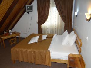 Un pat sau paturi într-o cameră la Belvedere