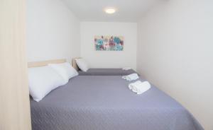 Postel nebo postele na pokoji v ubytování Apartment Rita