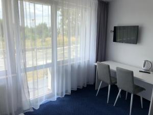 TV a/nebo společenská místnost v ubytování Złoty Łan