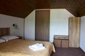 Pensiunea Panoramic tesisinde bir odada yatak veya yataklar