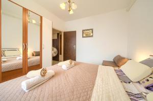 Postel nebo postele na pokoji v ubytování Apartman 3D