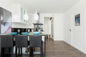 Kuchyňa alebo kuchynka v ubytovaní Apartamenty Morska Fala-Gardenia