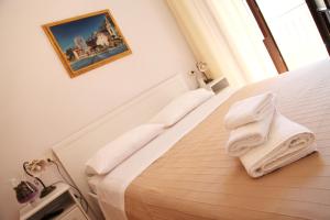 Posteľ alebo postele v izbe v ubytovaní Bed & Breakfast Duomo Di Taormina